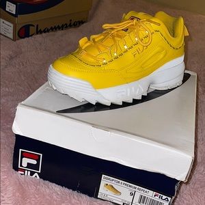 Yellow Fila Disruptors